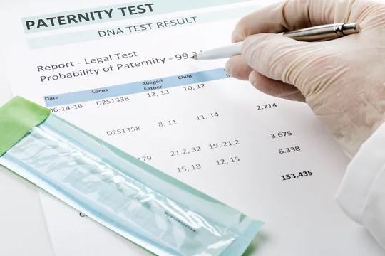 Image showing Paternity test data on a printed sheet.