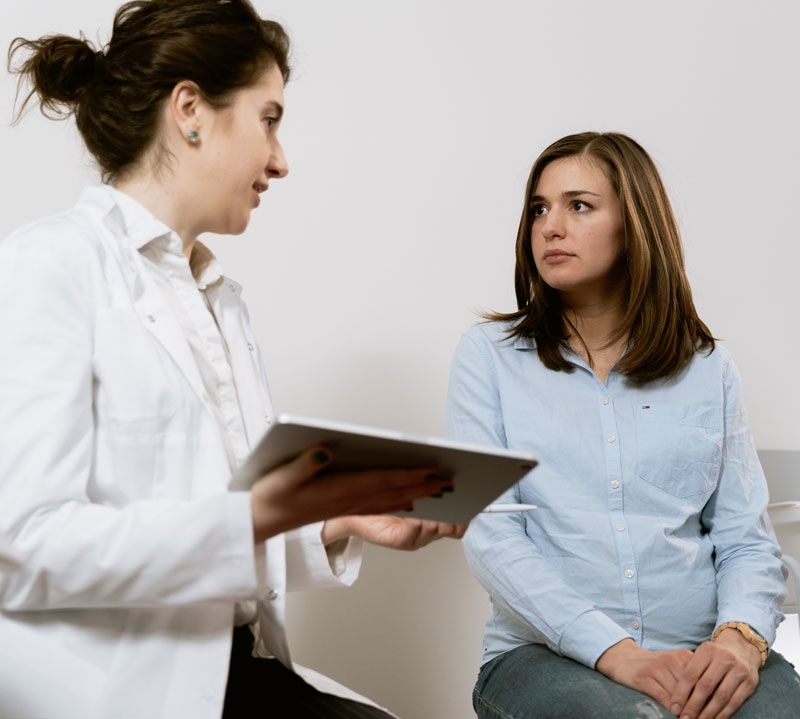 Image of doctor talking to patient